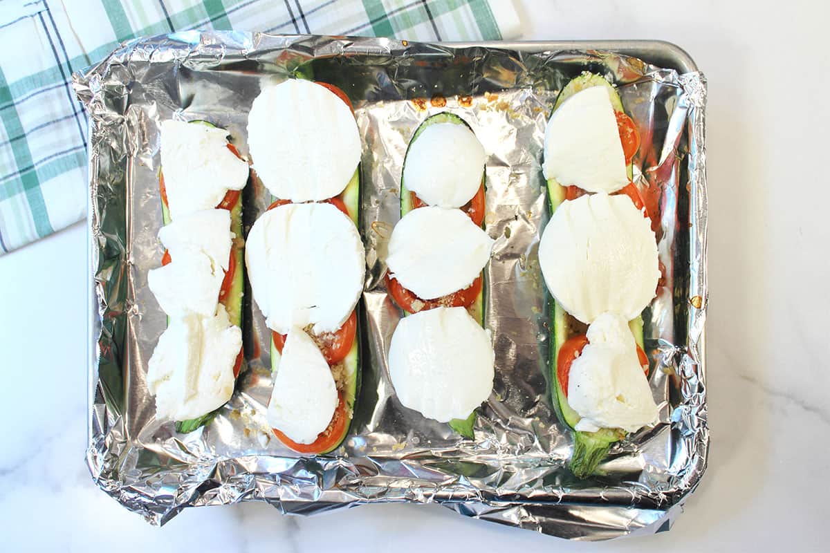 Lay mozzarella on cooked tomatoes.