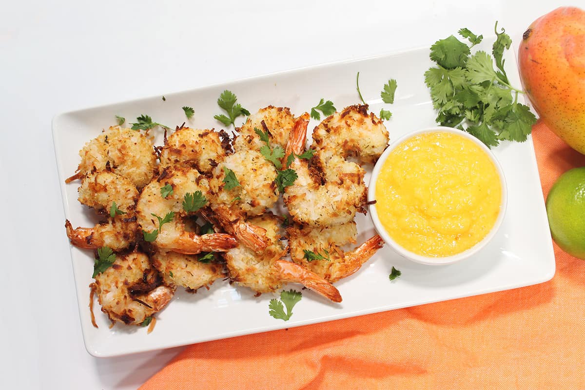 Platter of shrimp with sauce.