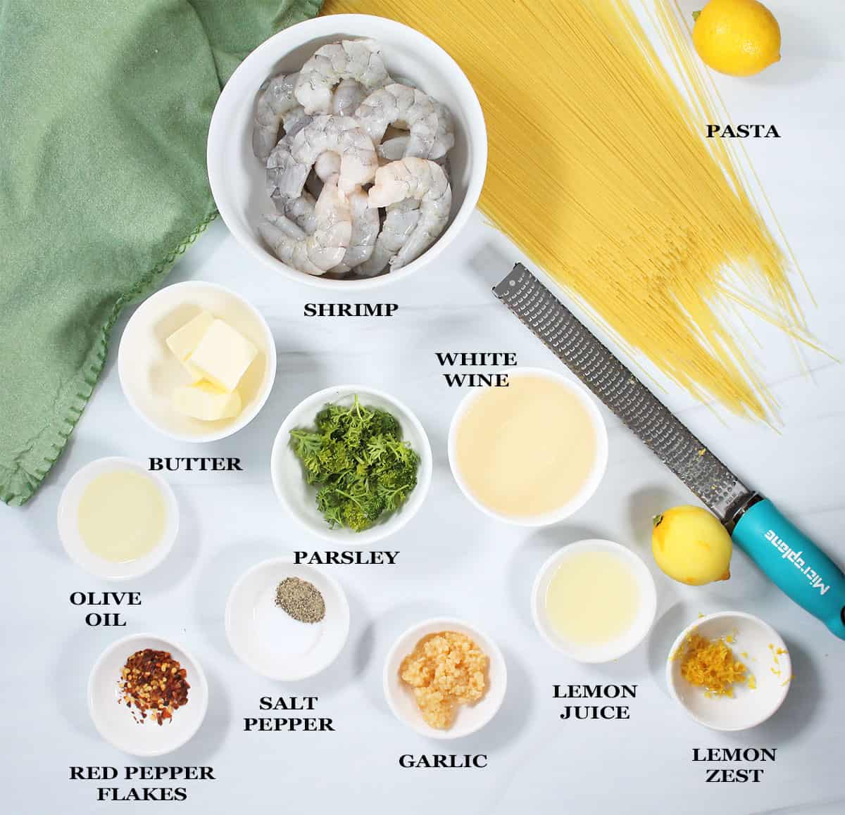 Ingredients for shrimp pasta with white wine sauce.