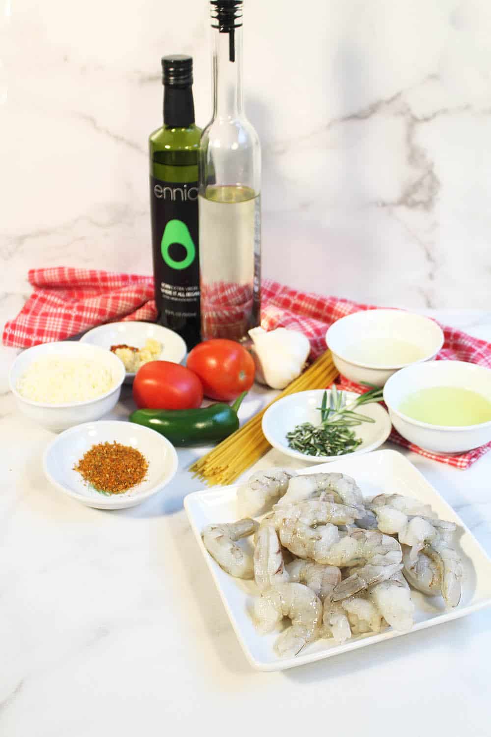 Ingredients laid out on table to make Cajun Shrimp Pasta.