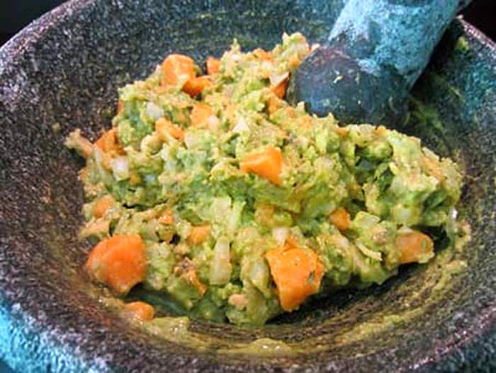 Mango Pineapple Guacamole prep in molcajete