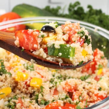 Closeup of spoonful of tabouli.