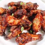 Closeup of Asian sticky wings in bowl.