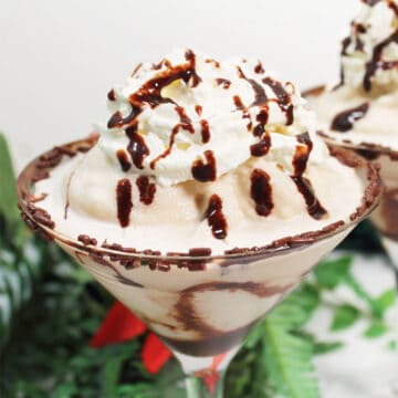 Closeup of whipped cream and garnished rim.