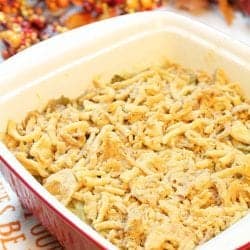 Baked casserole in front of fall berries and leaves.