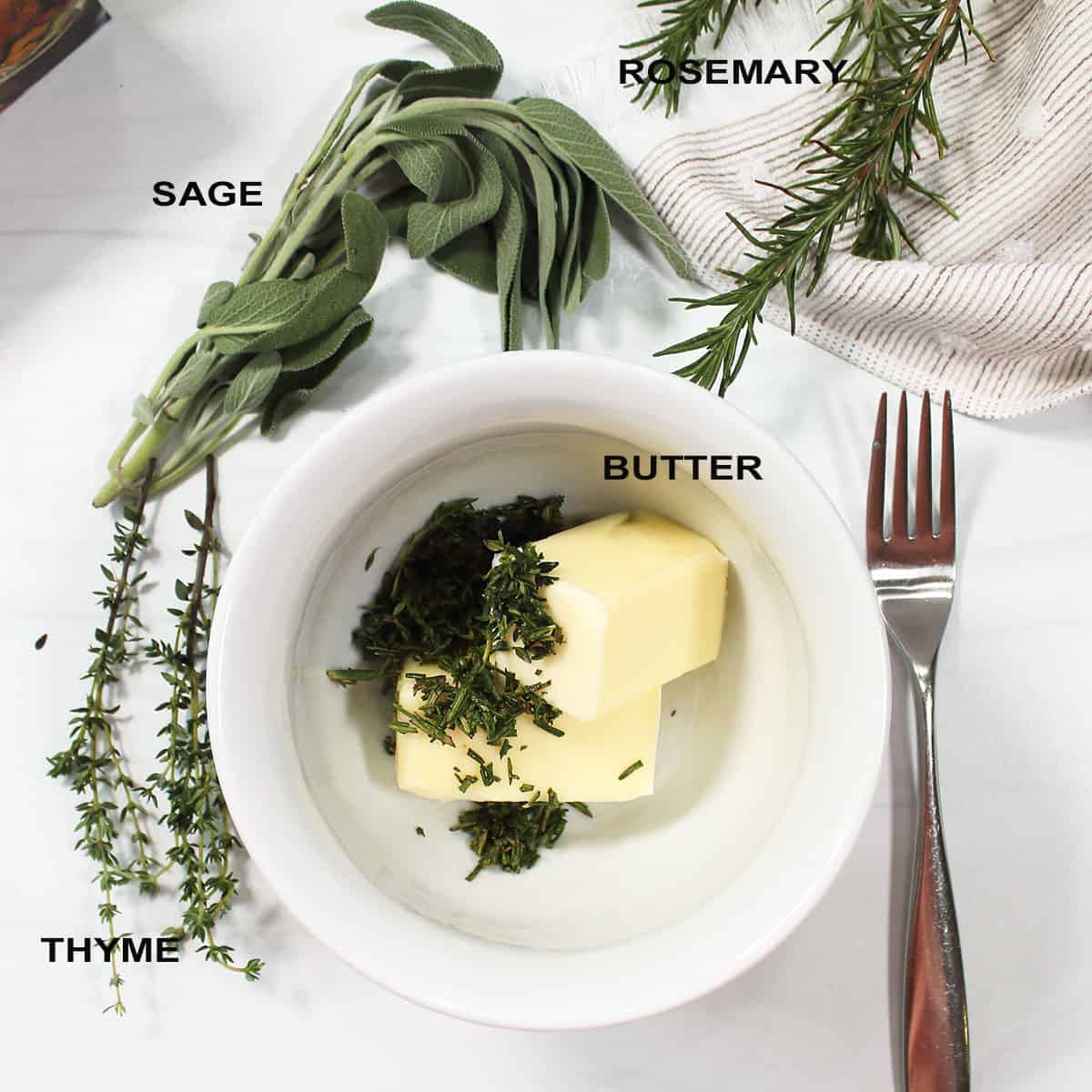 Herb butter ingredients in bowl.