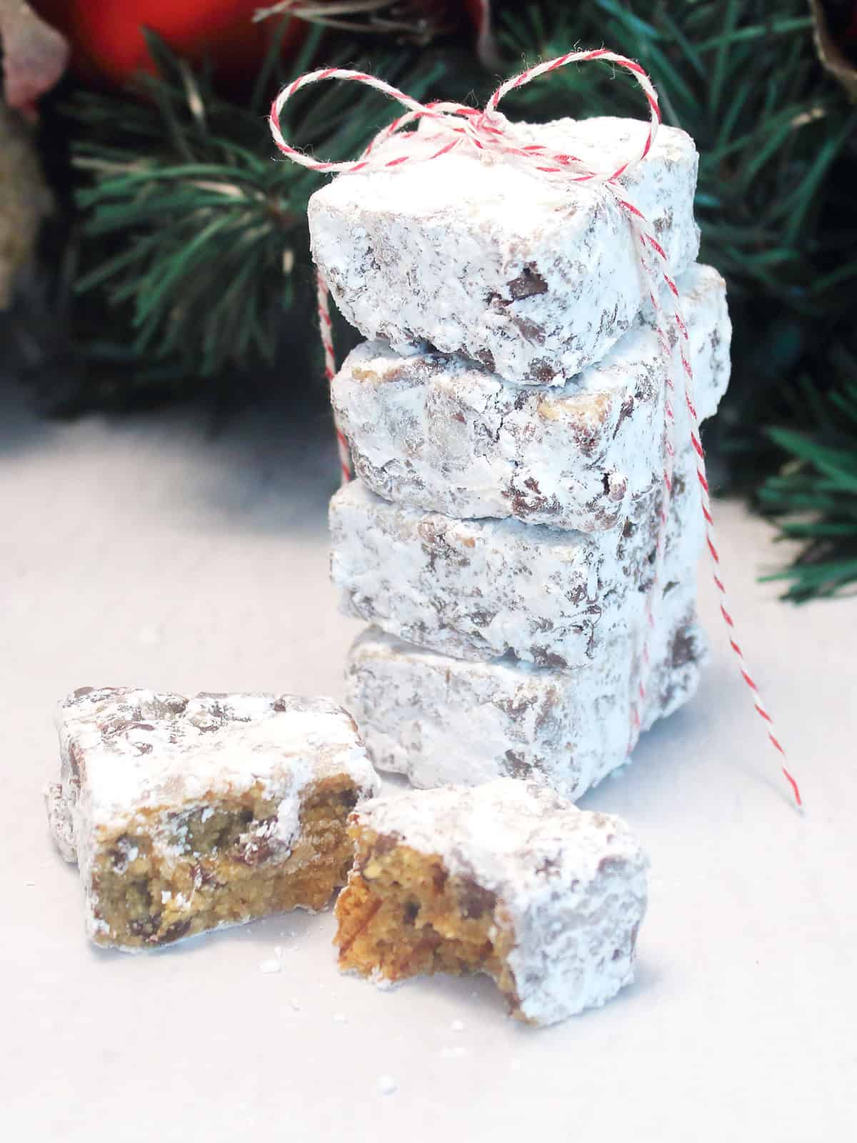 Chocolate chip graham cracker cookie bars stacked with twine around them.