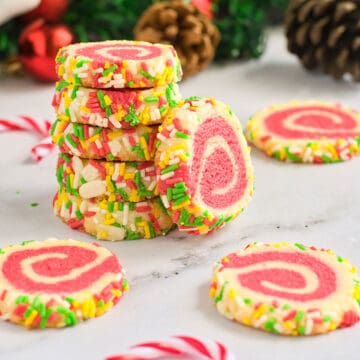 Stacked and scattered pinwheel cookies.