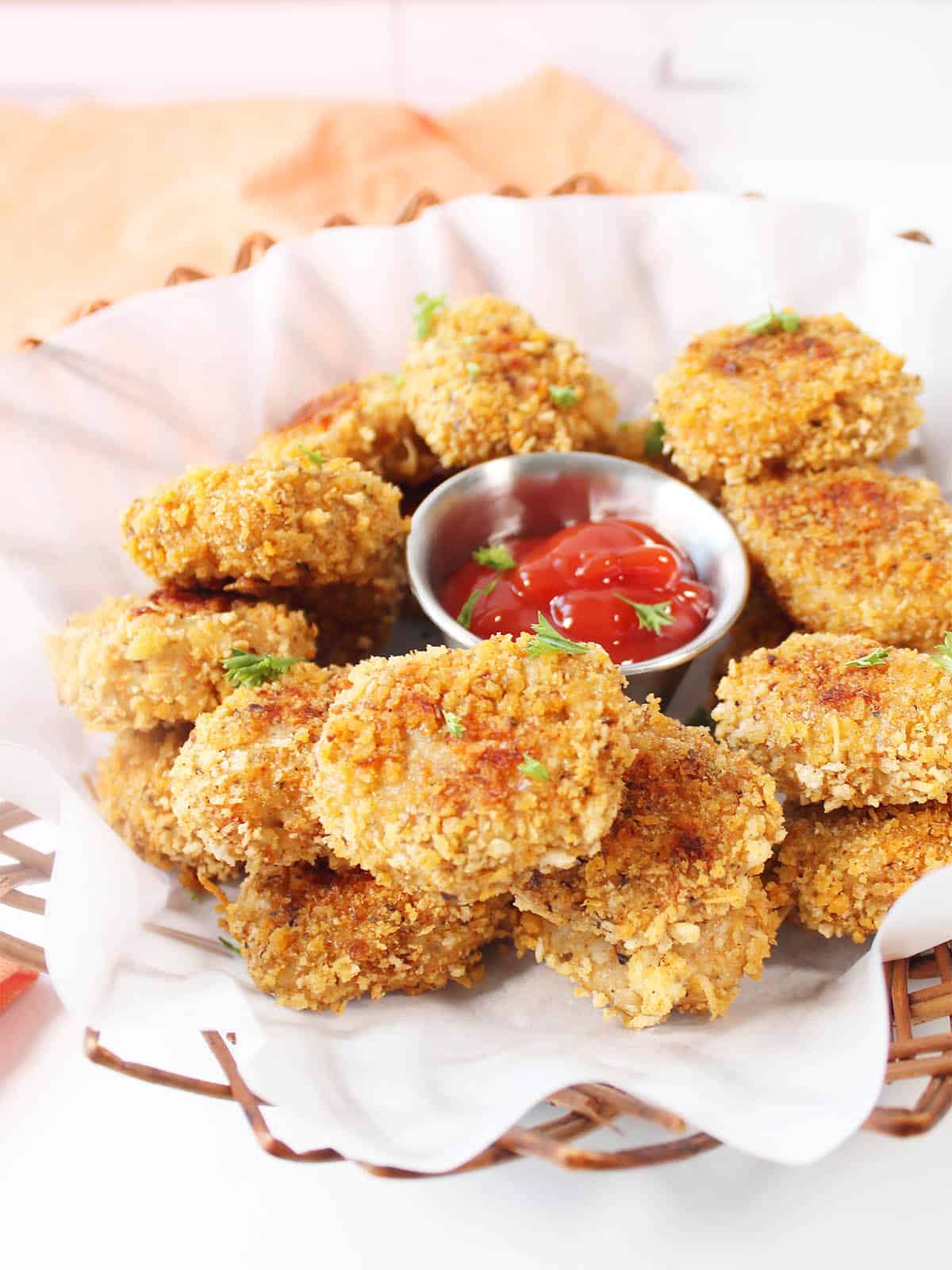 Gluten Free Chicken Nuggets in basket with ketchip.