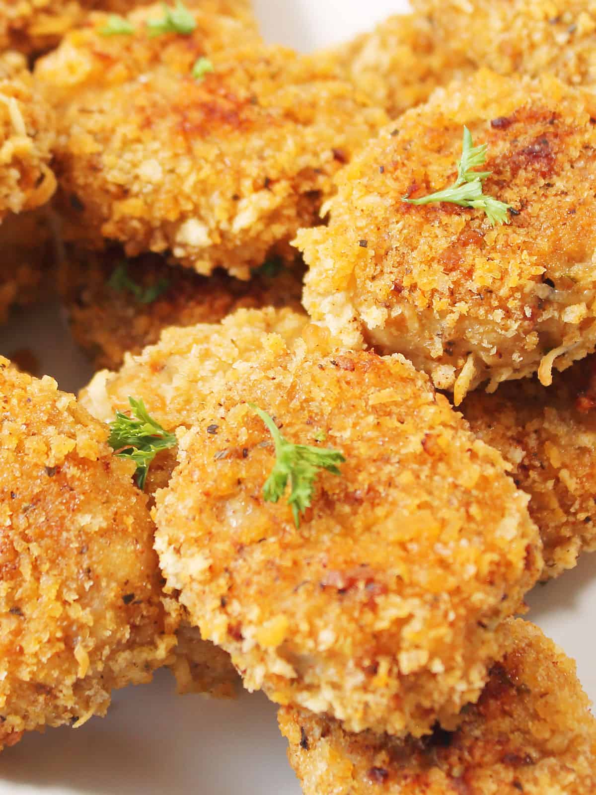 Closeup of crispy homemade chicken nuggets with ground chicken.