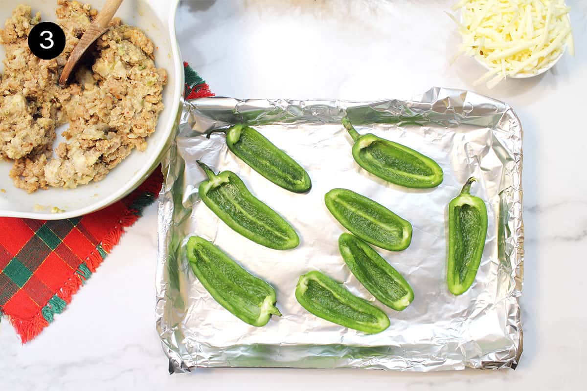 Halved jalapenos ready to stuff.