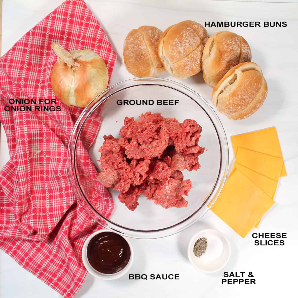 Ingredients for Rodeo Burgers on white table.