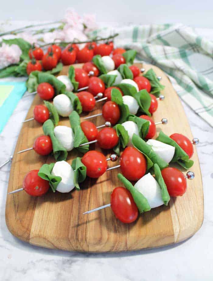 Skewered appetizer on wooden cutting board