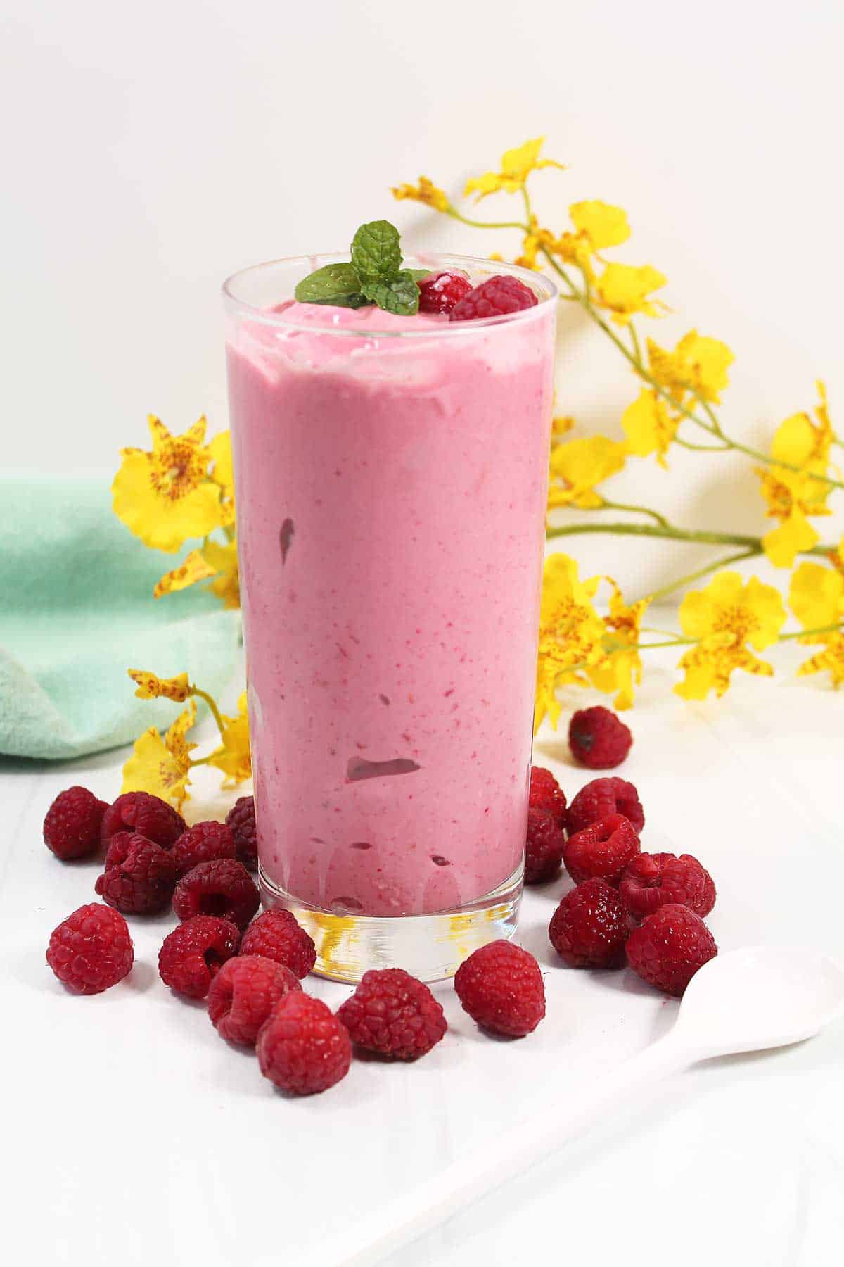 Raspberry Smoothie among raspberries.