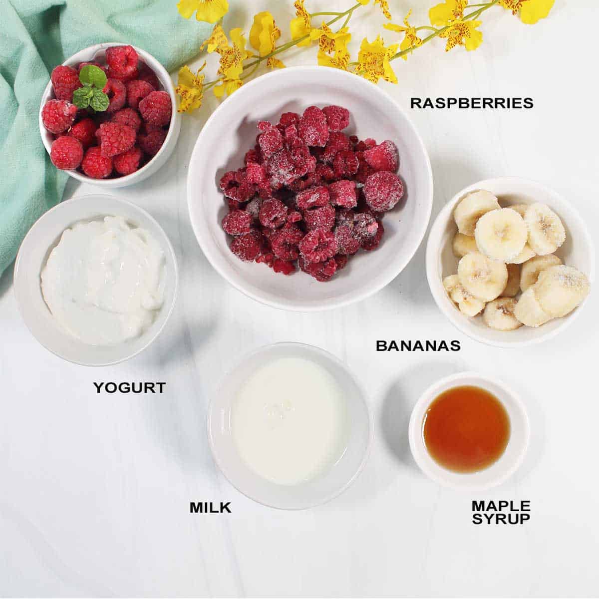 Ingredients to make smoothie with raspberries.