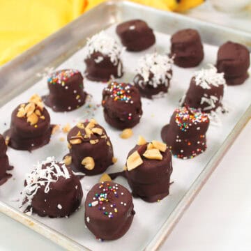 Frozen Chocolate Peanut Butter Banana Bites on baking sheet.