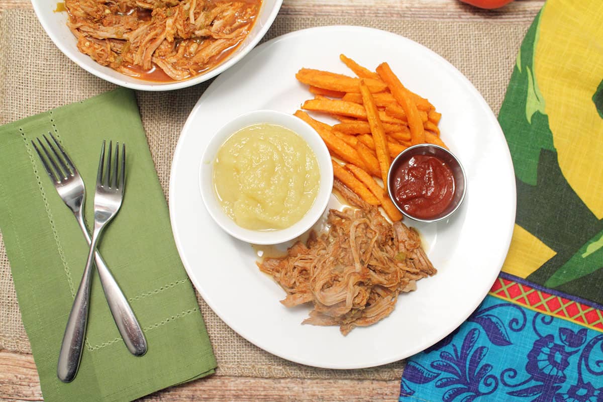 Overhead of Coca cCola pork roast dinner on white plate
