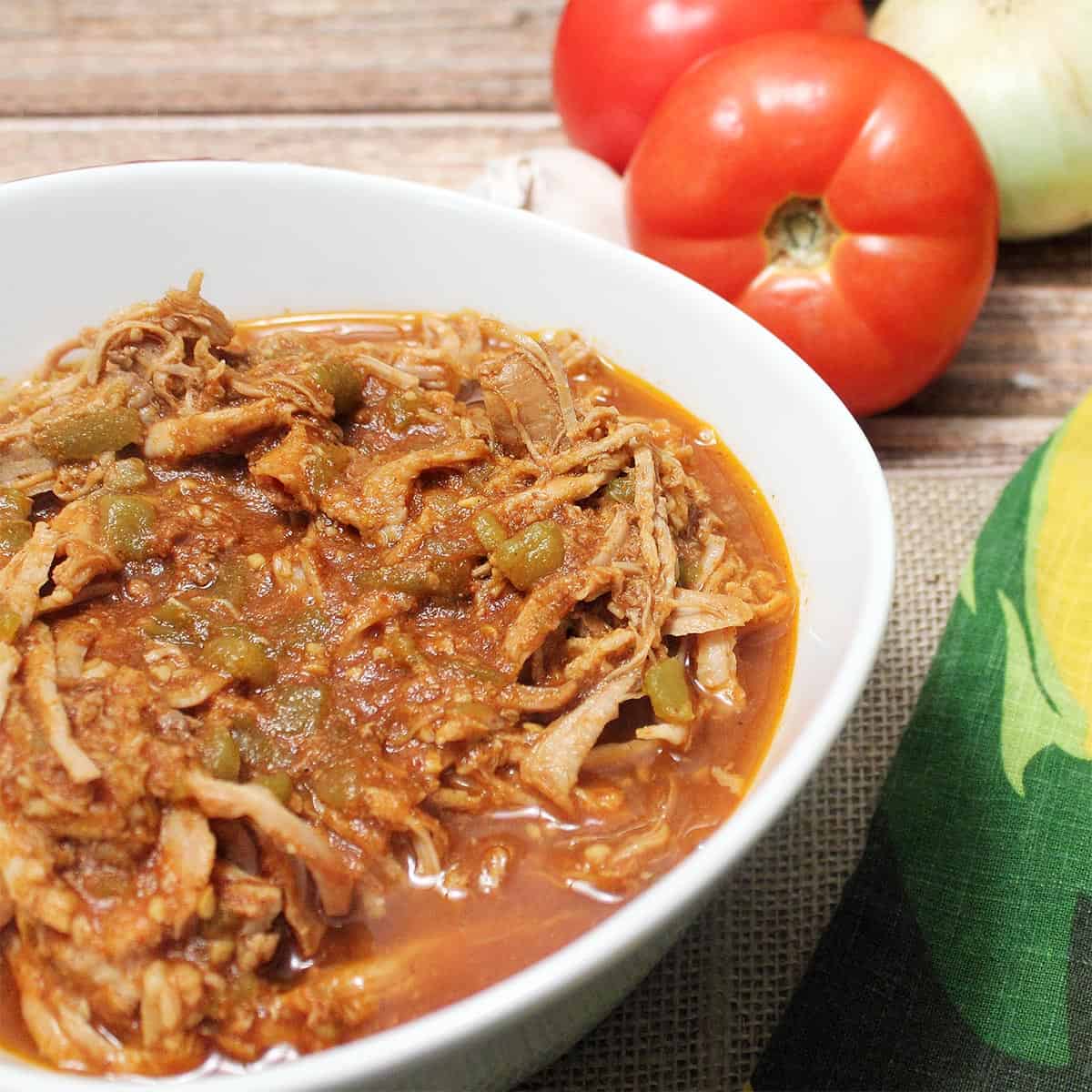 Cola pork in white serving bowl.