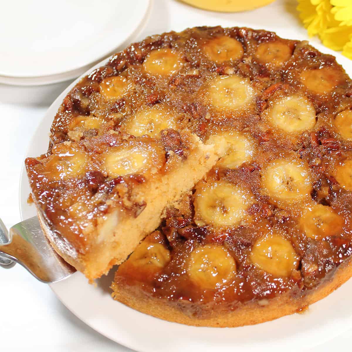 Lifting slice of Bananas Foster Upside Down Cake.