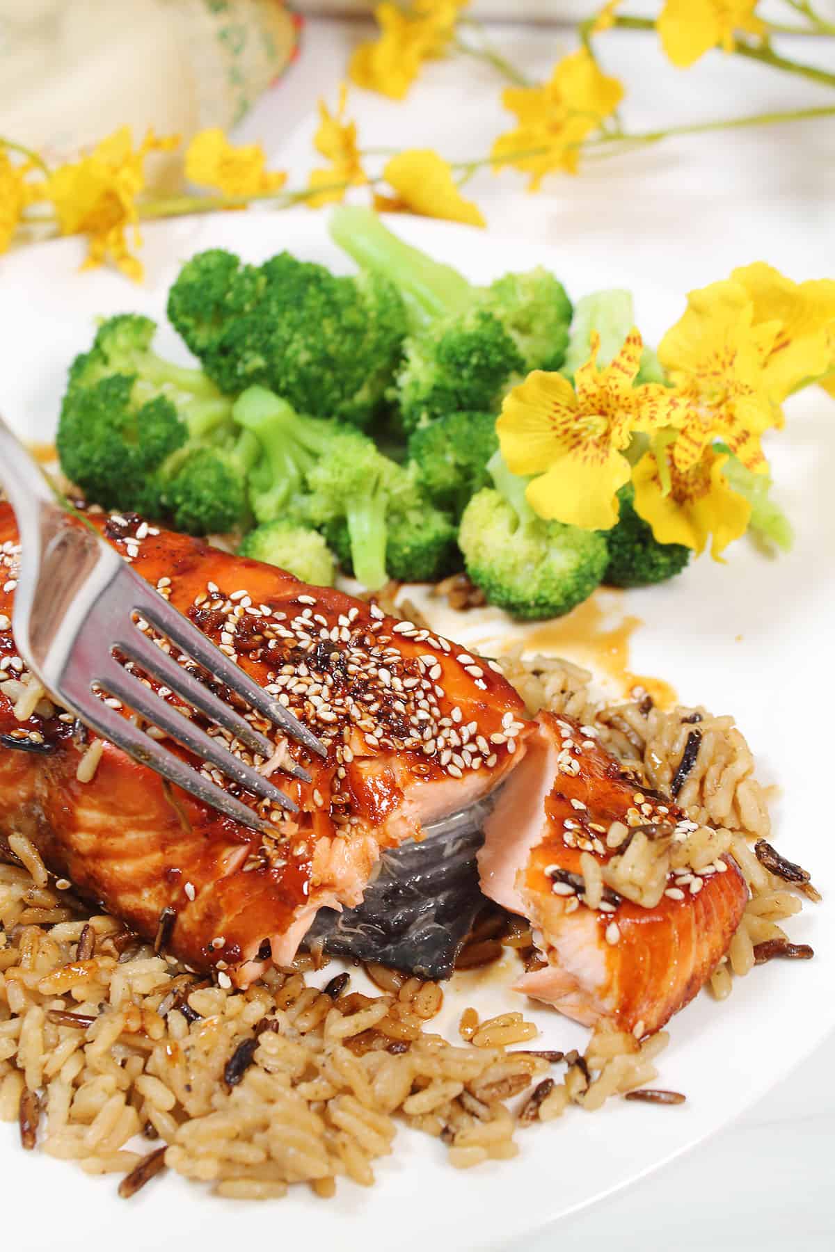 Showing flakiness of glazed baked salmon.