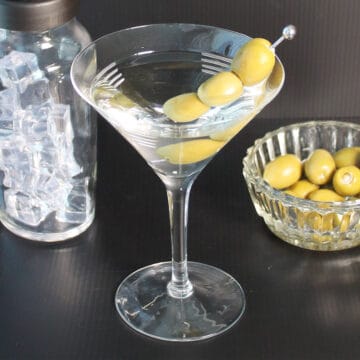 Classic martini in martini glass with olives.