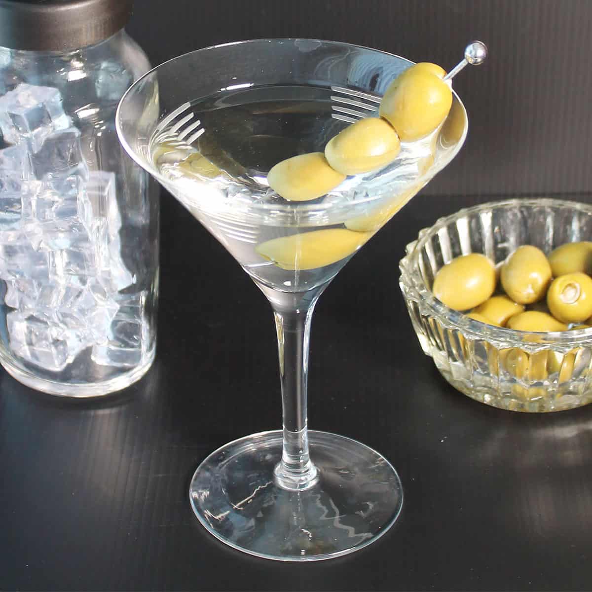 Classic martini in martini glass with olives.