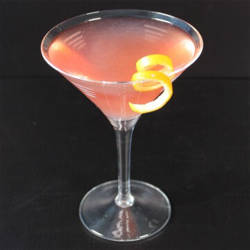 Cosmopolitan cocktail with orange twist.