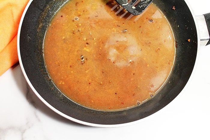Making the garlic wine sauce.