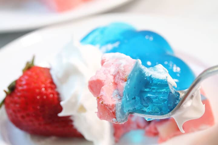 Bite of patriotic jello salad on fork.