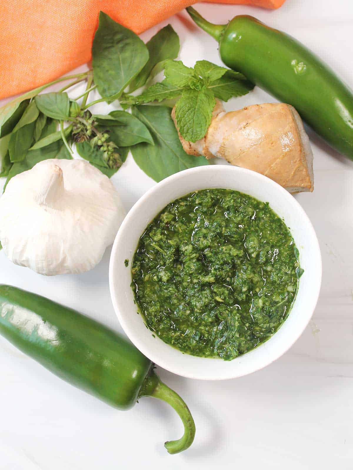 Thai Basil Sauce surrounded by fresh ingredients.