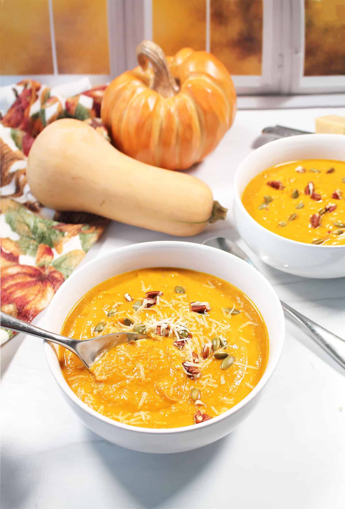 Butternut Squash Pumpkin Soup in bowl with spoon.