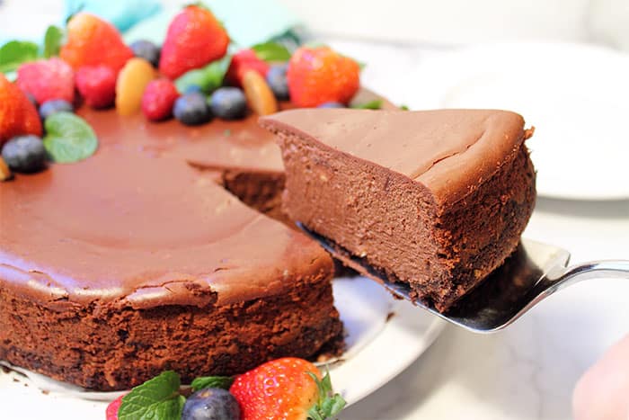 Lifting slice out of baked fudgecheesecake