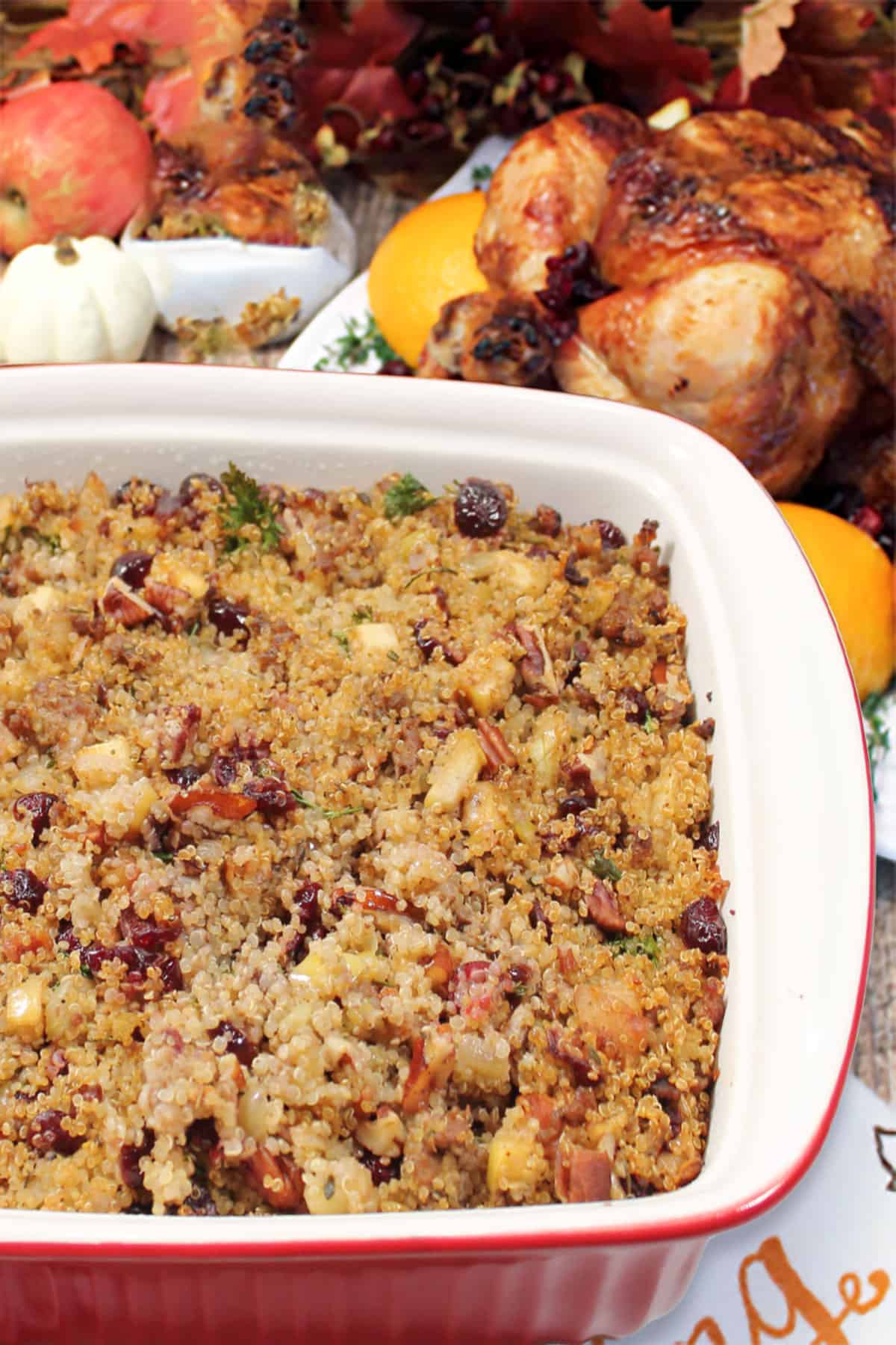 Closeup of stuffing with roasted turkey behind it.