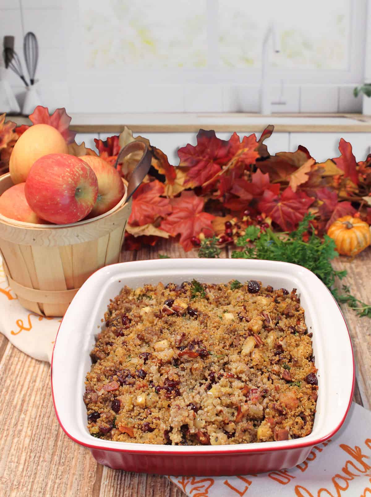 Baked gluten free quinoa stuffing on wooden table.