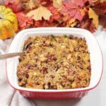 Baked gluten-free stuffing with spoon.