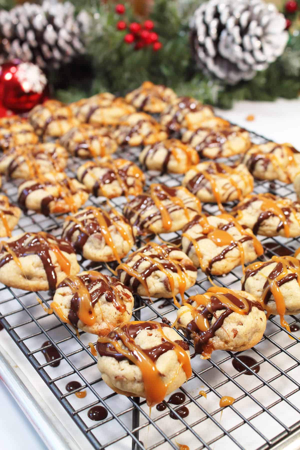 Drizzled cookies on wire rack.