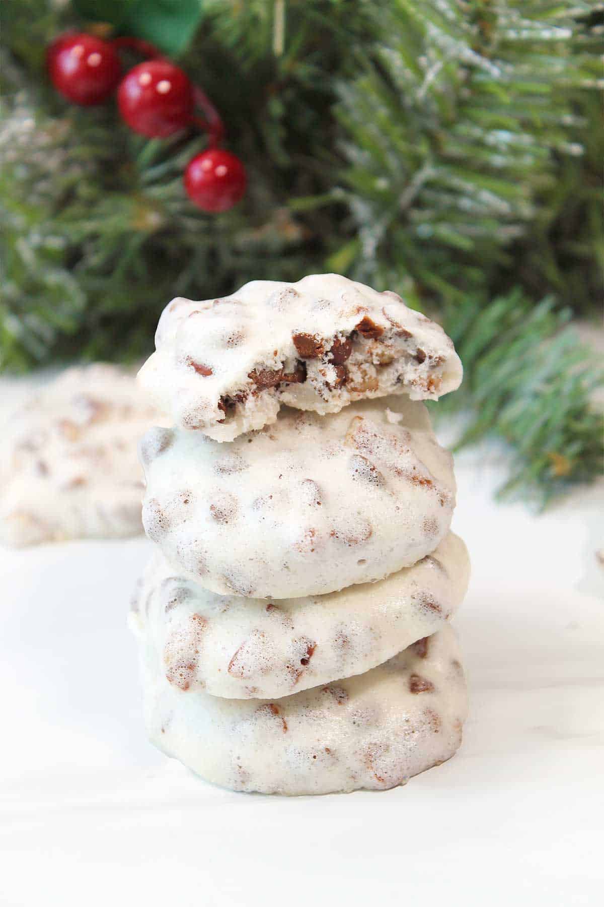 Stacked baked cookies with bite out of top one.