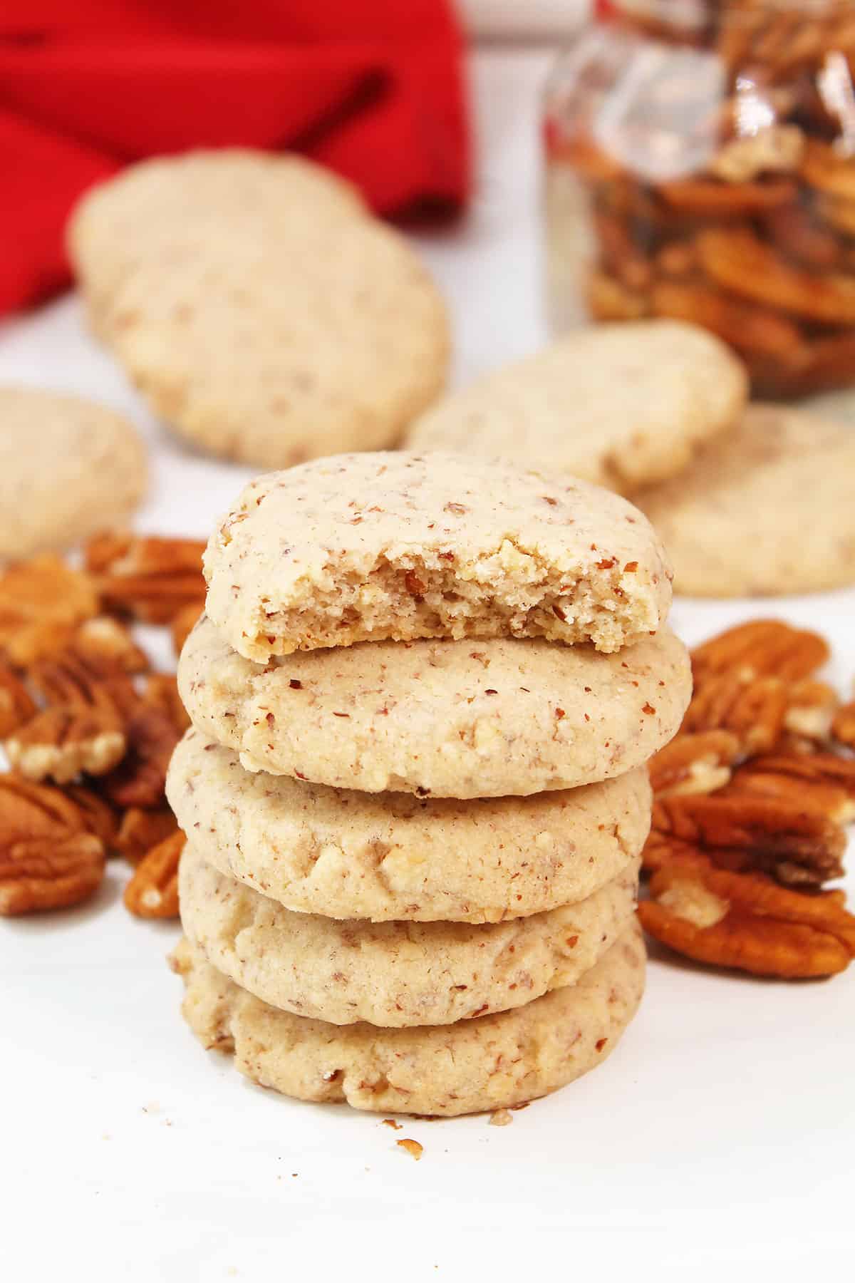 Stack of Pecan Sandies with bite out of top one.
