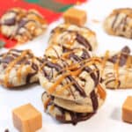 Stack of cookies near red plaid napkin.