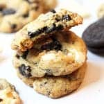 Stacked Oreo pudding cookies with bite taken out.