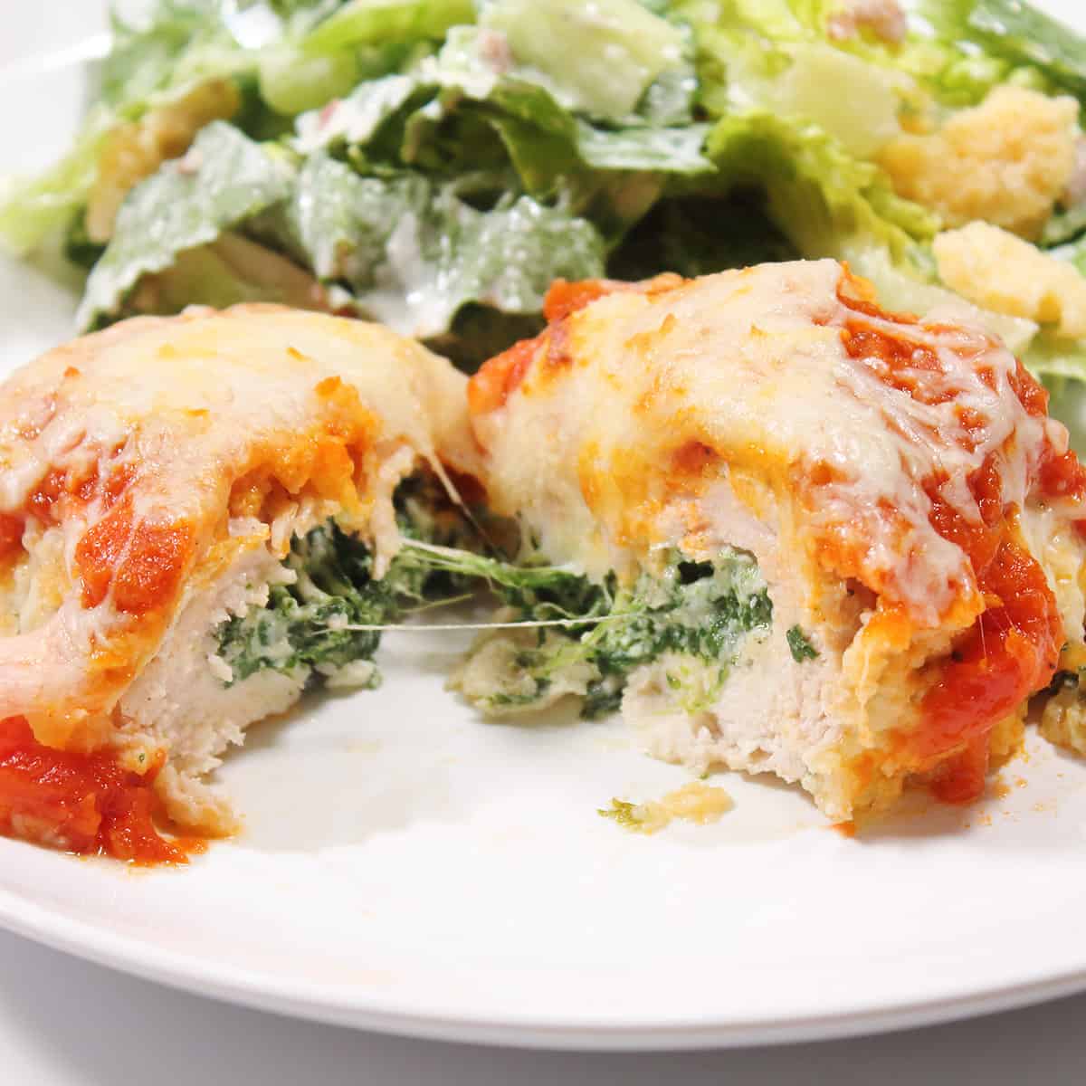 Stuffed chicken breast cut in half to show inside.