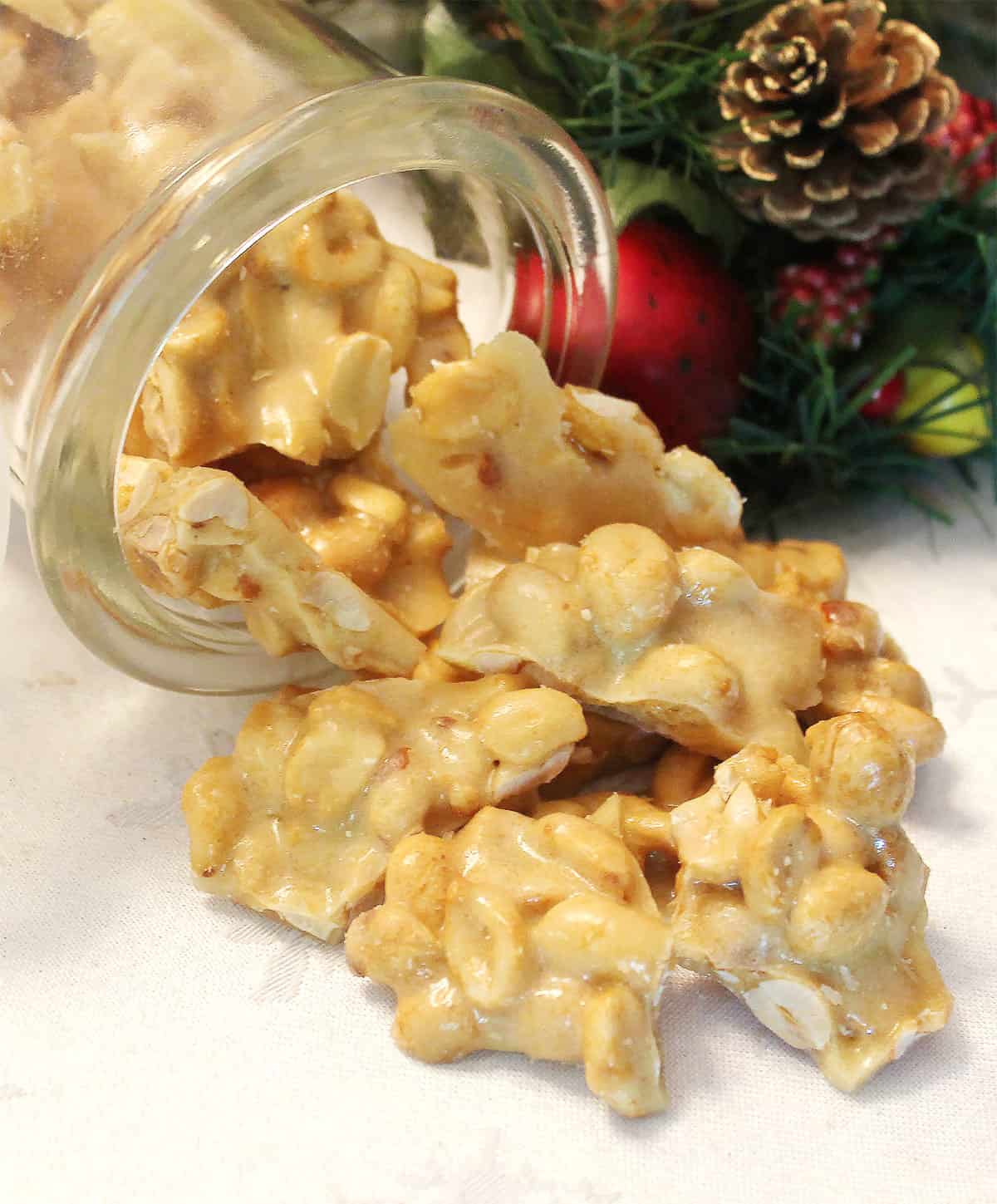 Easy peanut brittle spilling out of jar.