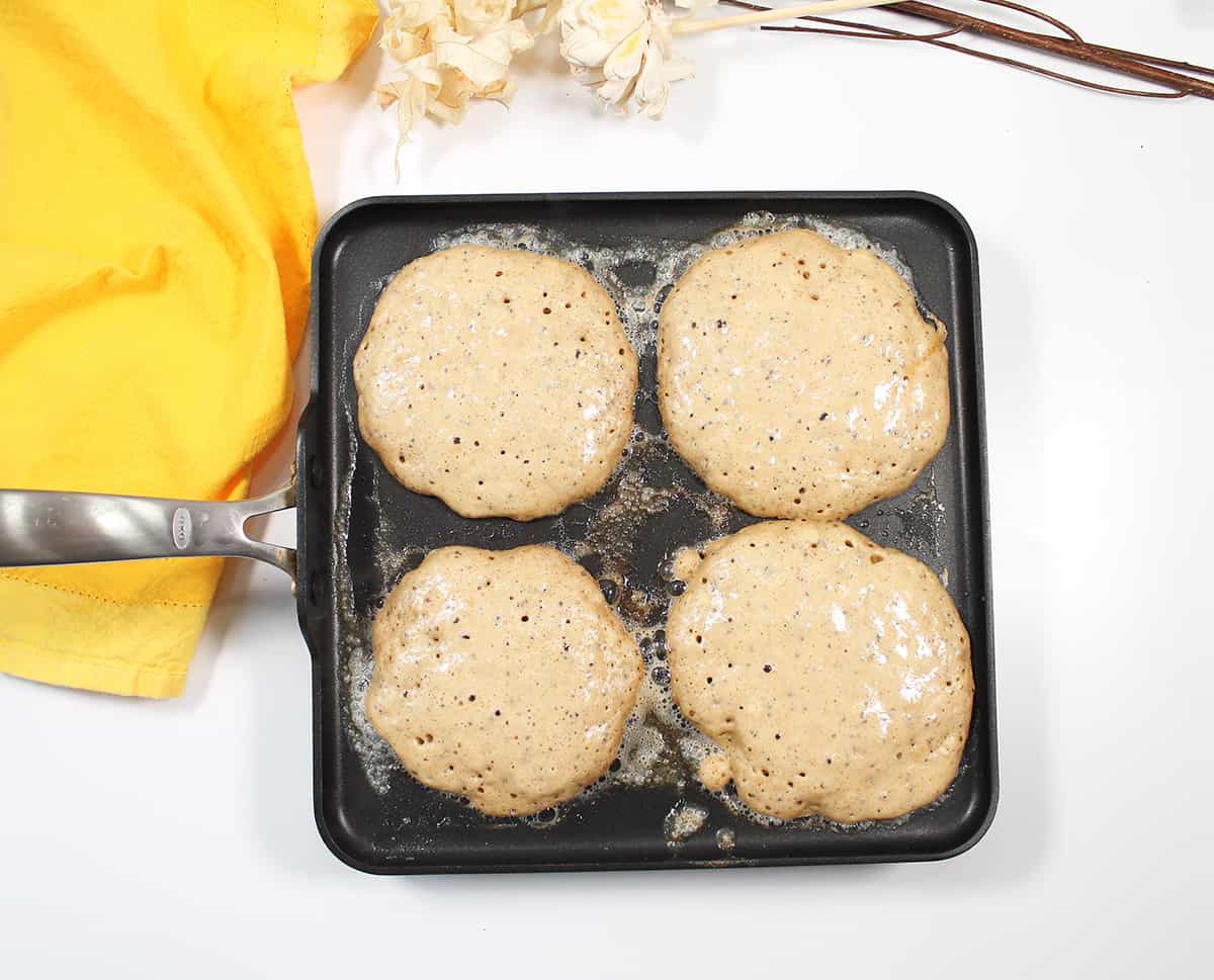 Pancakes on griddle.