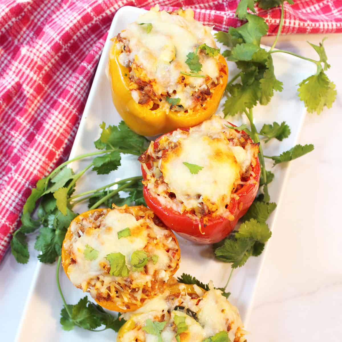 Overhead of Italian stuffed peppers on serving platter.