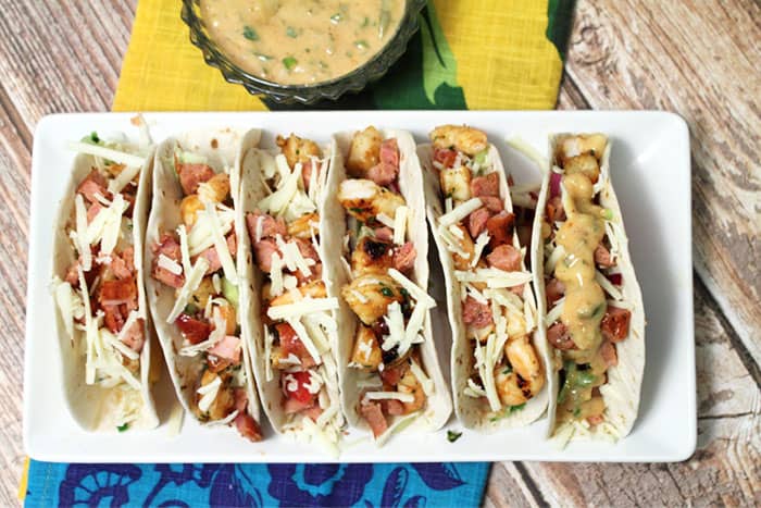 overhead of tacos on white plate