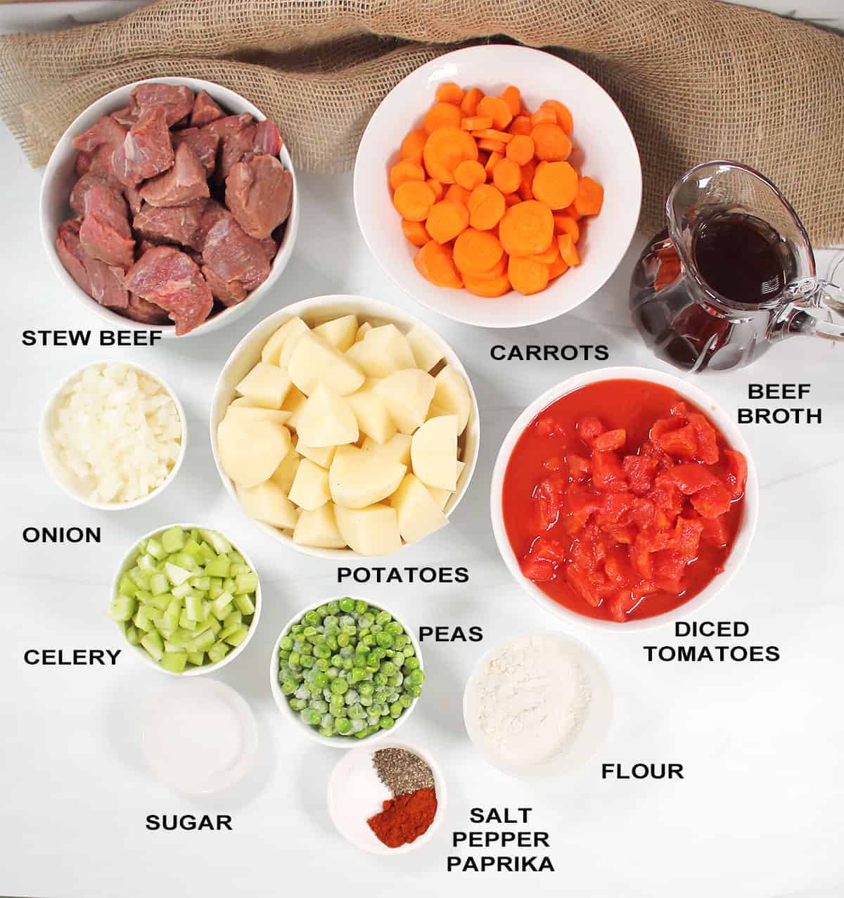 Ingredients for beef stew with vegetables in crock pot.