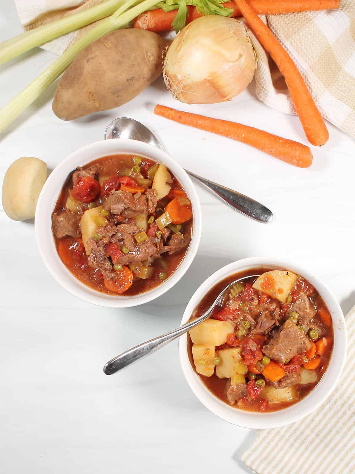 Thick hearty homemade beef stew in bowls.