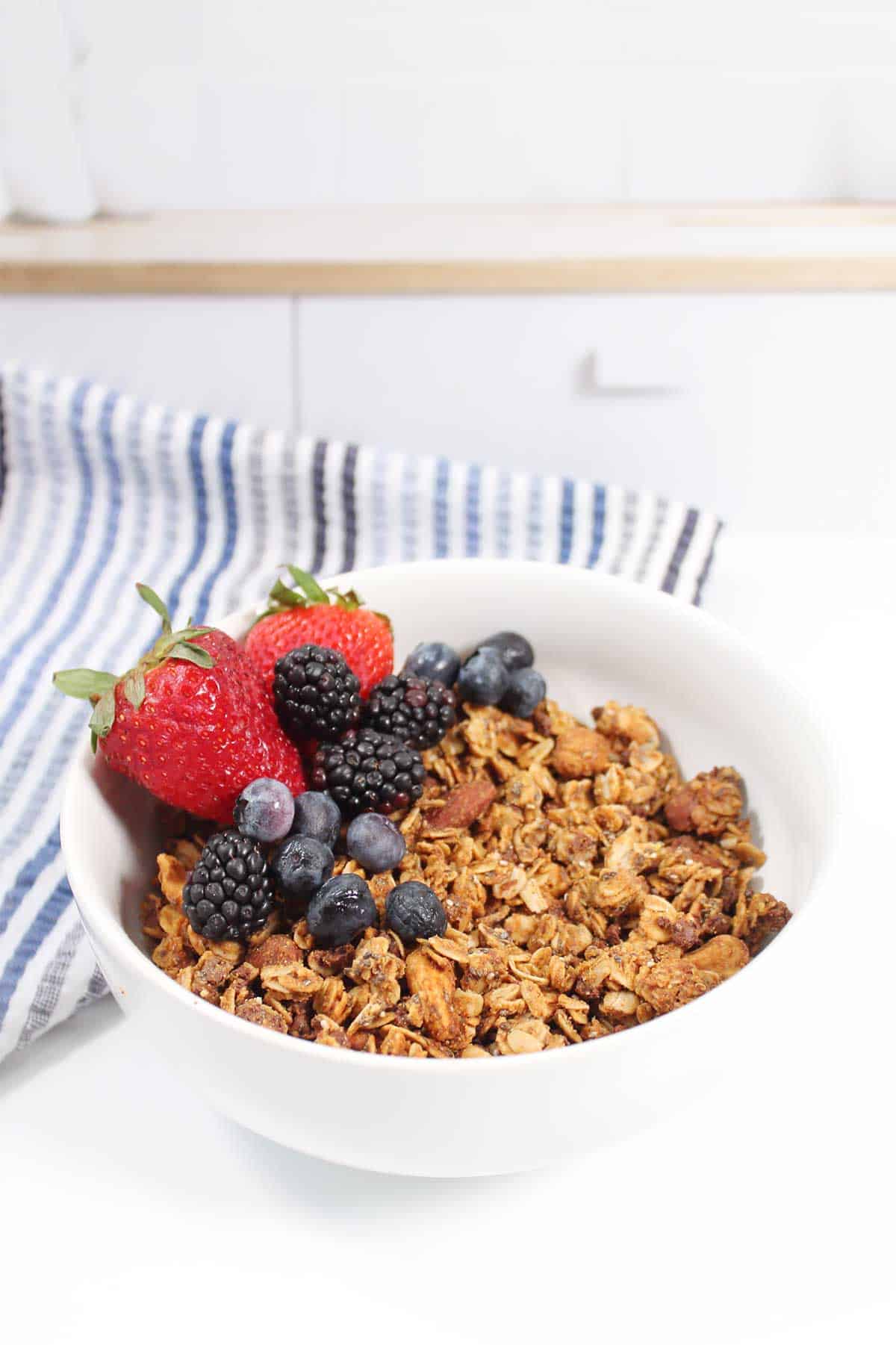 Granola in a bowl with berries.
