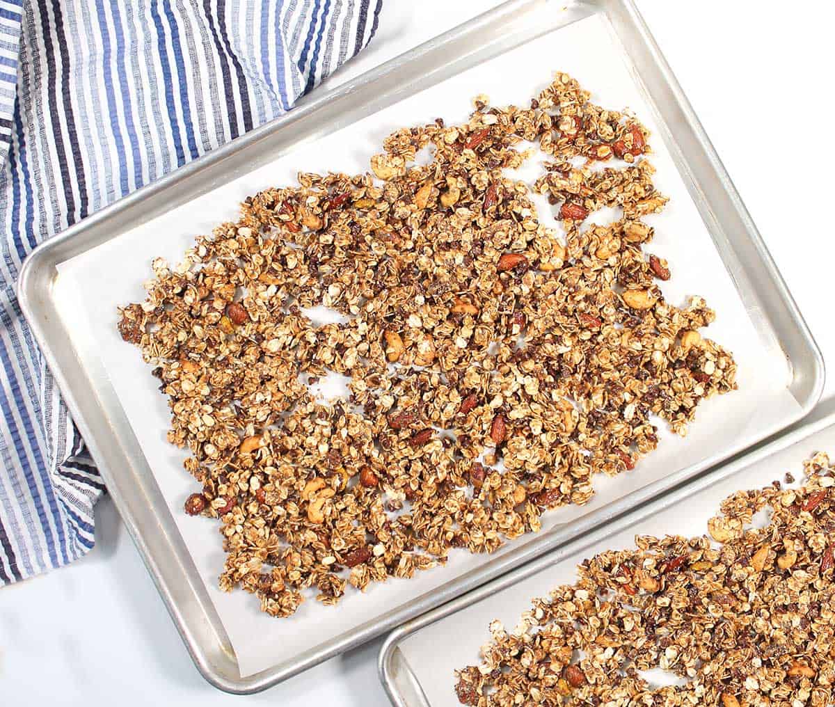 Granola on cookie sheets ready to bake.