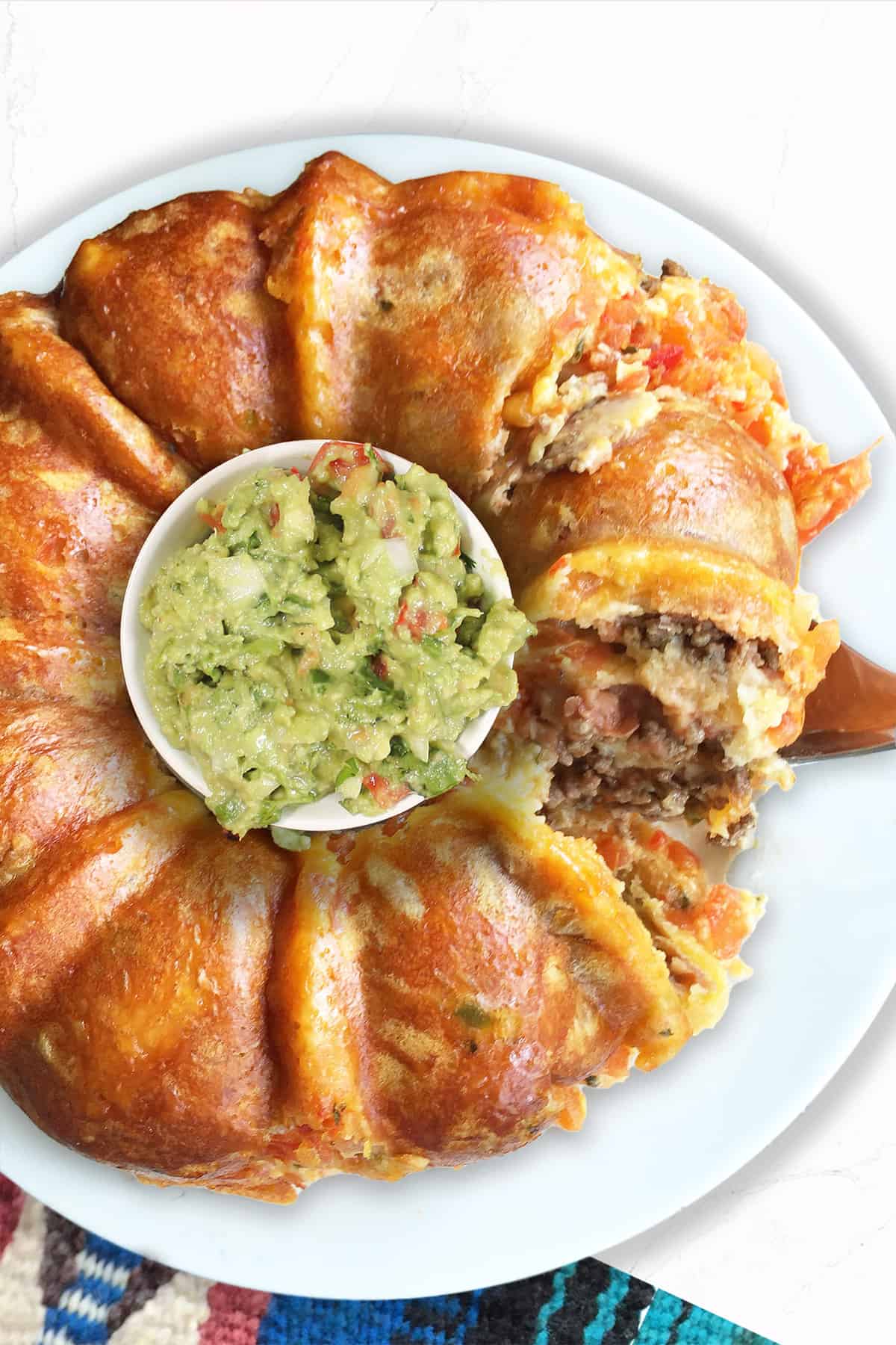 Lifting a slice out of taco ring.